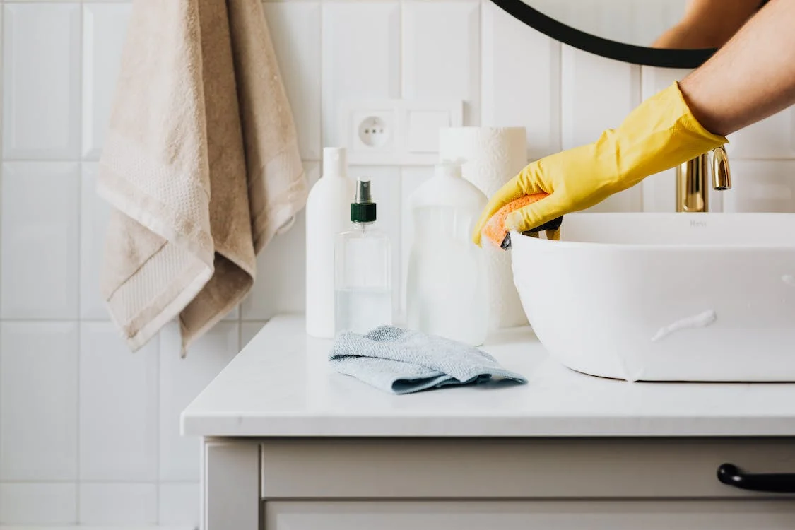 cleaning maid cleaning the bathroom